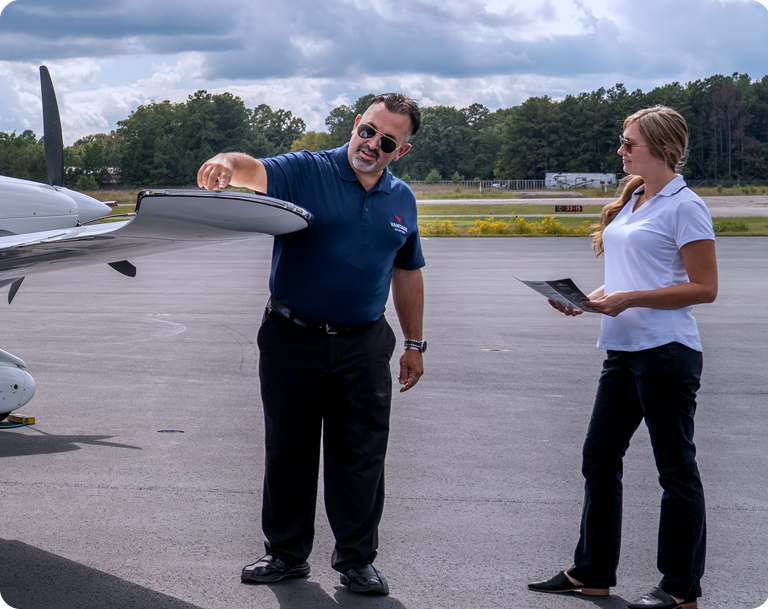 man and woman checking plane