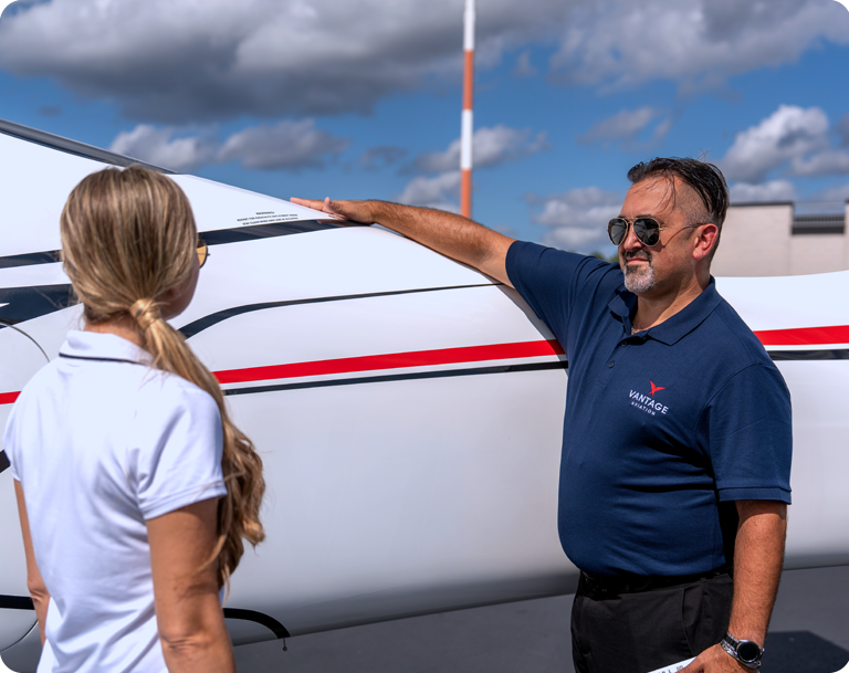 man and woman checking plane